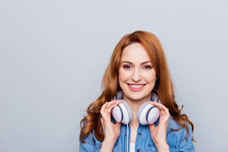 woman wearing casual blue jeans denim shirt isolated grey backgroundの写真素材