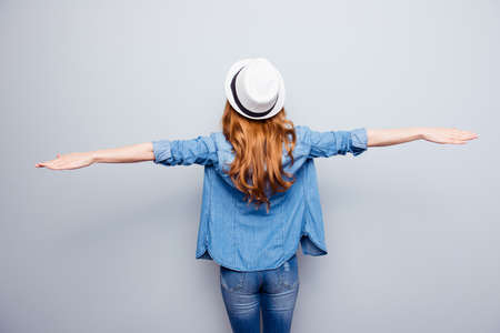 woman wearing casual blue jeans denim shirt isolated grey backgroundの写真素材