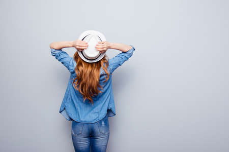 woman wearing casual blue jeans denim shirt isolated grey backgroundの写真素材