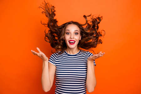 woman wearing casual stripe  shirt isolated orange backgroundの写真素材