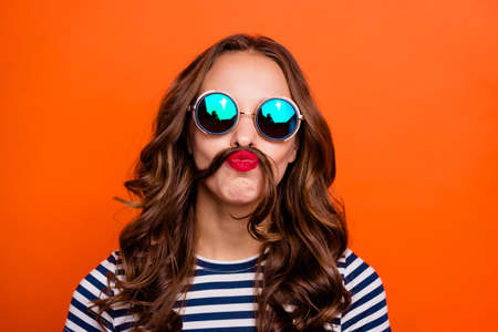 woman wearing casual stripe  shirt isolated orange background