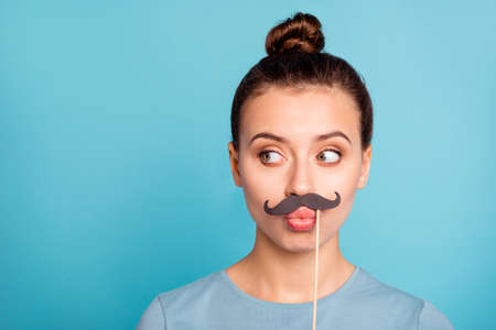 Portrait of nice cute charming youth hold hand stick accessories birthday anniversary celebrate holiday fool ridiculous wear fashionable spring clothes isolated on bright backgroundbの写真素材