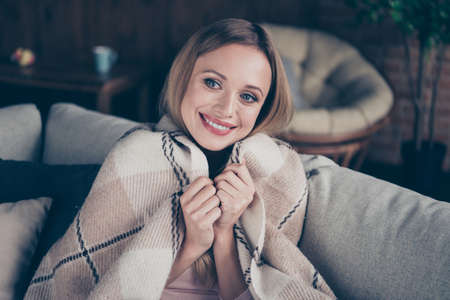 Close-up photo portrait of excite satisfied with life style she her healthy lady wrapping herself using soft cover sitting on divanの写真素材