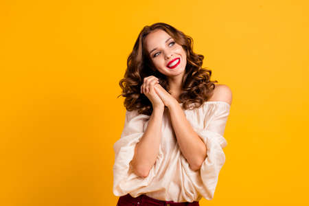 Portrait of her she nice-looking well-groomed attractive fascinating winsome positive cheerful cheery wavy-haired girl dreaming isolated over bright vivid shine yellow backgroundの写真素材