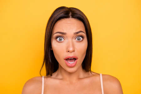 Close up photo beautiful amazing she her lady opened mouth big eyes full fear epic fail speechless mute silent wear casual pastel tank-top outfit clothes isolated yellow bright vibrant backgroundの写真素材
