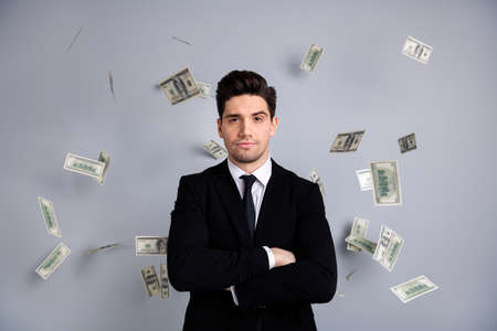 Portrait of his he nice attractive content guy top manager financier banker economist sum currency lottery credit loan flying in air blow wind agent broker isolated over light gray backgroundの写真素材