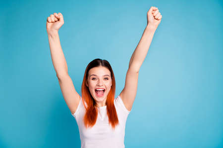 Portrait of cute funny funky lady raise fists have free time celebrate aim goals shout yell...