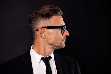Close-up portrait of his he nice attractive content intelligent guy executive director shark ceo boss chief sales agent broker expert specialist isolated over black backgroundの写真素材