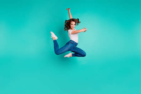 Full length body size view of her she nice attractive lovely graceful professional sportive slim fit thin wavy-haired lady practicing modern art isolated on bright vivid shine blue backgroundの写真素材