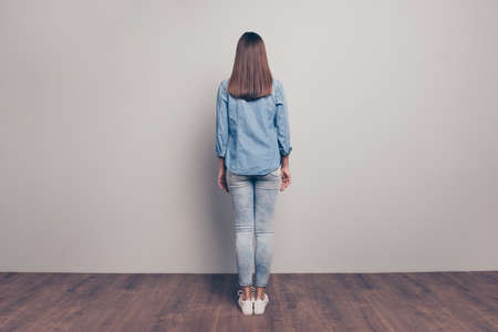 Back rear behind view photo of charming stunning gorgeous lovely people lady good-looking peaceful relax rest free time nice wear fashionable spring millennial clothing isolated argent backgroundの写真素材