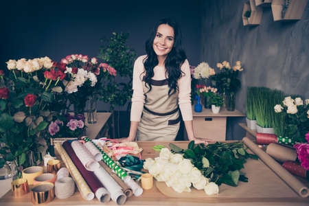 Portrait of her she nice-looking charming lovely attractive cheerful wavy-haired businesslady employer fresh perfect desirable festal spring gift hobby industrial loft interior concrete wall workplace.の写真素材