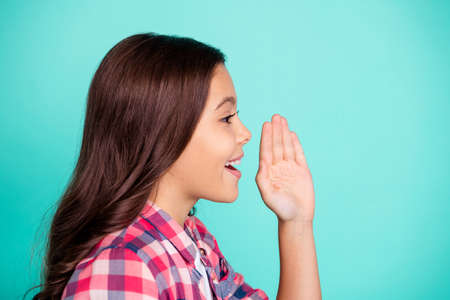 Profile side view photo loud charming little people amazed positive satisfied content enjoy checked shirt trendy isolated share private information future promoter promotion advertise teal background.の写真素材
