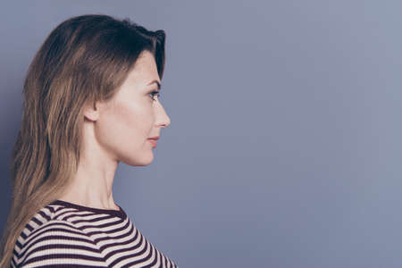 Close-up profile side view portrait of her she nice-looking attractive charming pretty wavy-haired lady copy space isolated over gray pastel violet purple backgroundの写真素材