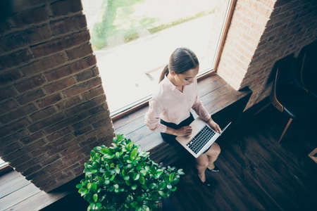 Above high angle view of her she one person nice attractive chic gorgeous busy lady ceo boss chief writer author writing essay article at modern industrial loft interior style work place stationの写真素材