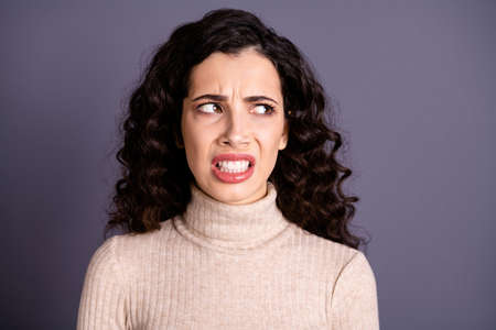 Close-up portrait of her she nice lovely attractive charming cute mad annoyed offended wavy-haired lady looking aside idea isolated over gray pastel backgroundの写真素材
