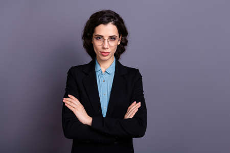 Portrait of charming gorgeous stylish trendy entrepreneur ready solve problems troubles dressed black jacket classy outfit wavy curly hairstyle isolated grey backgroundの写真素材