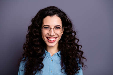Portrait of nice attractive lady have enterprise leader leadership curly wavy hairstyle shirt blue denim jeans isolated grey backgroundの写真素材