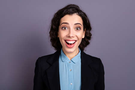 Close up photo of delighted nice cute lovely lady youth astonished impressed wonder incredible scream shout wavy curly hairdo haircut dressed black blazer isolated backgroundの写真素材