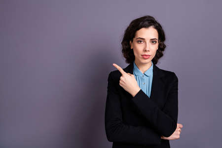 Portrait of charming elegant freelancer feel concentrated smart intelligent clever recommend attention pick tip wavy curly haircut hairdo isolated grey backgroundの写真素材