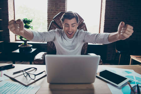 Portrait of his he nice attractive cheerful cheery excited executive partner company founder director money budget salary growth at industrial loft brick style interior work place stationの写真素材