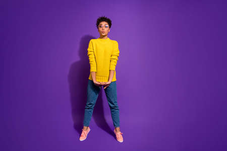 Full length body size view portrait of nice attractive lovely cheerful positive funny funky wavy-haired girl sending air kiss isolated over bright vivid shine violet backgroundの写真素材