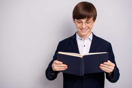 Portrait positive cheerful nerd geek hold hand printed book feel enjoy joy dressed, eyewear...