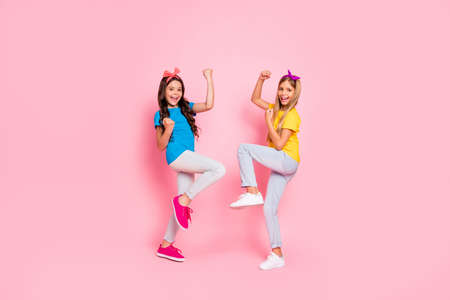 Full size photo of cheerful kids scream yeah have aims fortune wear pants, trousers headbands...