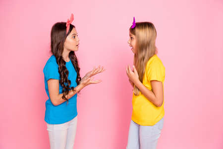 Profile side view portrait of two nice-looking attractive charming cute lovely, discontent puzzled...