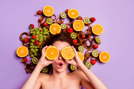 Close-up portrait of her she nice attractive lovely cheerful cheery girlish comic playful childish wavy-haired lady having fun closing covering eyes like glasses isolated over violet purple backgroundの写真素材