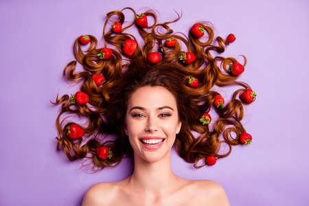 Close-up portrait of her she nice-looking sweet winsome charming cute attractive lovely nude naked cheerful wavy-haired lady berries in hairdress isolated over violet purple backgroundの写真素材
