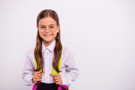 Close-up portrait of her she nice attractive lovely sweet winsome intellectual cheerful cheery positive pre-teen girl nerd isolated over light white grey backgroundの写真素材