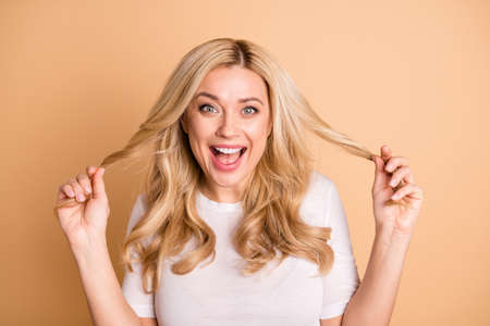 Portrait of charming lady youth touch haircut hairdo shout laughted isolated beige background