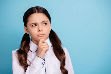 Close up photo of thoughtful kid have dilemma difficult test touch chin wear white blouse isolated...