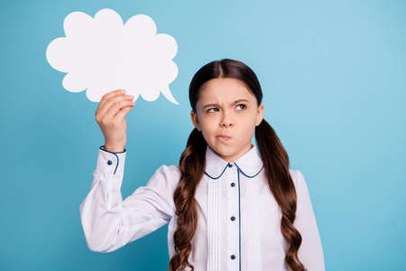 Portrait of minded kid hold hand paper cloud have thoughts wear trendy stylish blouse isolated over...