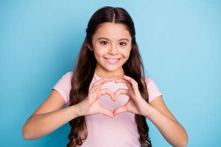 Portrait of nice cute charming girl show affection support bonding to mom parent boys school mate kids valentine day concept feel glad candid isolated on pastel background wear fashionable outfitの写真素材