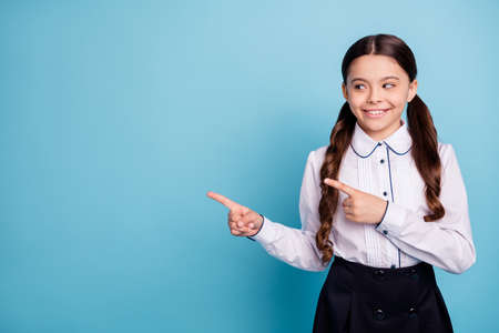 Portrait of cunning kid look trendy stylish isolated over blue backgroundの写真素材
