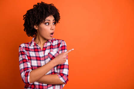 Close-up portrait of nice attractive amazed wondered cheerful wavy-haired lady wearing checked shirt...