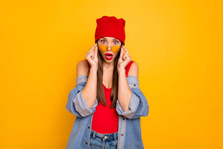 Portrait of astonished trendy youth touch specs shout hear unexpected information isolated over...