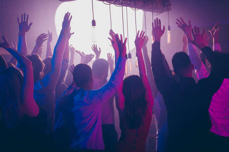 Back side view photo of student excited prom feel content listen people holiday band singers song raise hands chill formalwear formal wear stylish trendy free time carefree carelessの写真素材