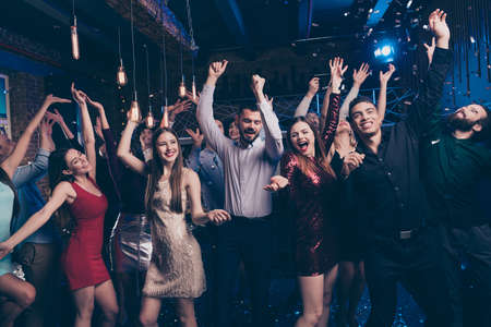 Portrait of careless carefree bachelorette diversity multinational social party maker raise hand arms scream content formal wear formaLwear discothequeの写真素材