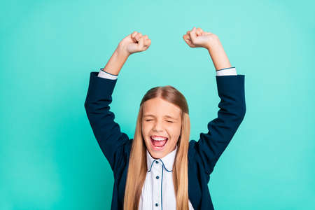 Close up photo beautiful amazing yelling she her little lady hands arms raised up glad end finish last studying day wear formalwear shirt blazer school form isolated bright teal turquoise backgroundの写真素材