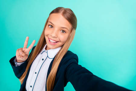 Close up photo beautiful amazing yelling she her little lady hands arms v-sign symbol make take selfies wear formalwear shirt blazer jacket school form isolated bright teal turquoise backgroundの写真素材