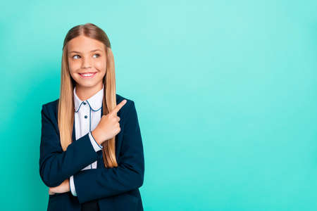 Close up photo beautiful she her little lady wondered look low prices hand arm index finger empty space proposition wear formalwear shirt blazer school form isolated bright teal turquoise backgroundの写真素材