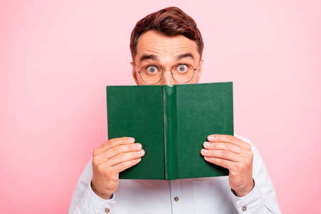 Close up photo portrait of comic cheerful enthusiastic with big staring looking eyes holding paper...