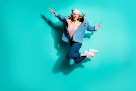 Full length body size view of her she nice-looking attractive cool carefree cheerful cheery girl having fun time spring vacation isolated on bright vivid shine blue green turquoise backgroundの写真素材
