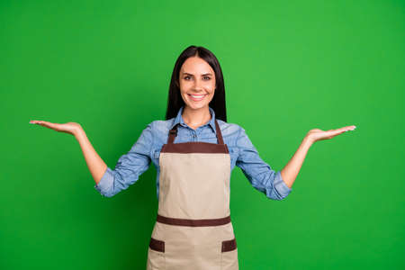 Close up photo beautiful she her lady hands arms sides demonstrate assure customers buy buyers best option pick one low price wear jeans denim shirt covered work apron isolated black grey backgroundの写真素材