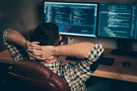 Profile side view of brunet guy ceo boss chief company founder professional expert specialist sitting in front of screen digital html at wooden industrial interior work place stationの写真素材