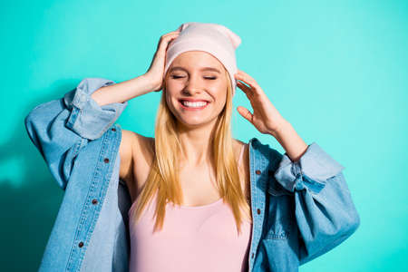 Close-up portrait of nice-looking attractive lovely sweet charming cute cheery girl wearing street style clothing accessory isolated over bright vivid shine blue green turquoise backgroundの写真素材