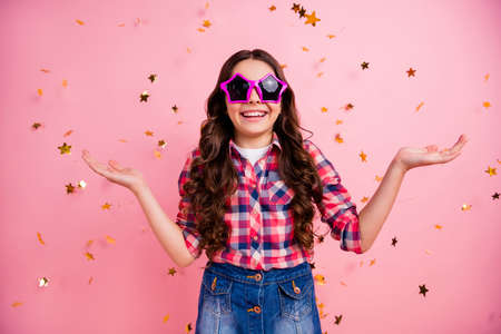 Portrait of cute astonished cheerful nice lady people youth kid hold hand impressed unbelievable stylish trendy unexpected wow omg dressed checked denim jeans clothing over pink backgroundの写真素材