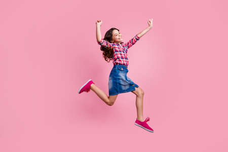 Full length body size view photo cute pretty lovely sweet kid raise hands arms close eyes pleasure satisfied funky funny stylish checked shirt denim jeans skirt long haircut isolated pink backgroundの写真素材